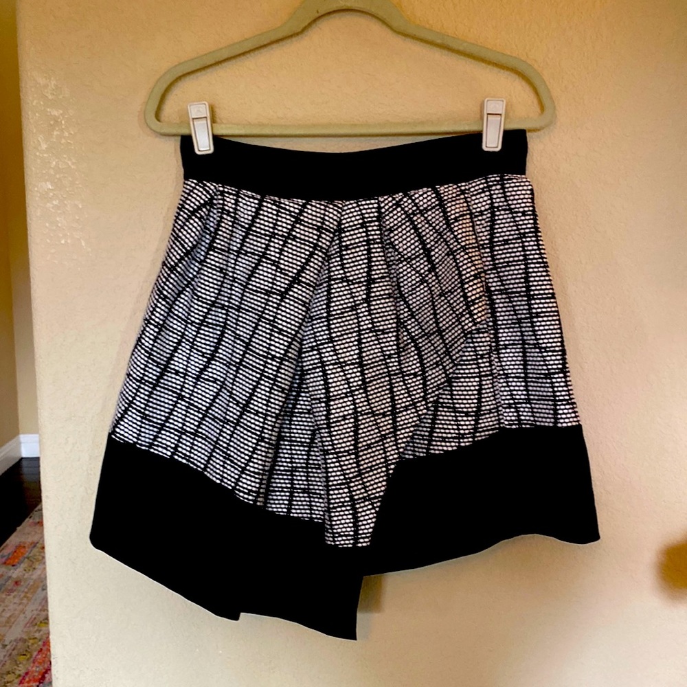 BR, mini skirt, size 6, gold zipper in back, asymmetrical ruffle in front